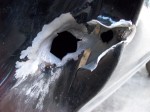 The hole from the bullet that entered right behind and below the driver seat of our pickup